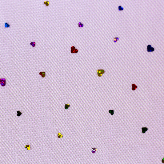 Image of soft tulle with hearts on a lilac background 40 g/m² – available at Šarlotes audumi