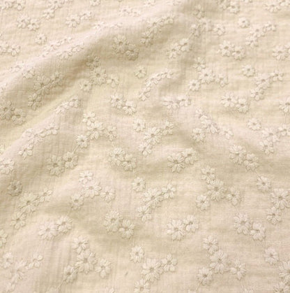 Image of embroidered muslin - beige flowers 180 g/m² – available at Charlotte's Fabrics