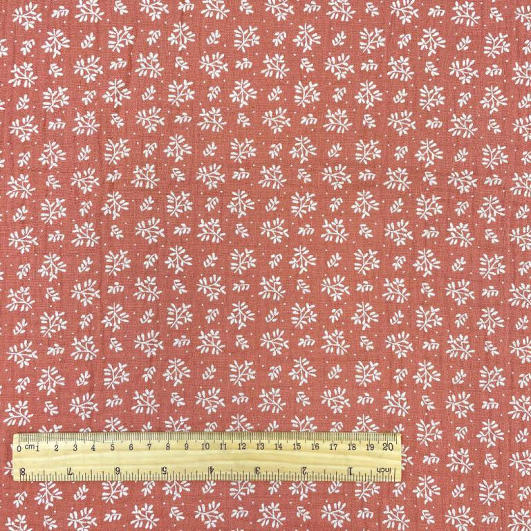 muslin - white flowers on an orange background 130 g/m²