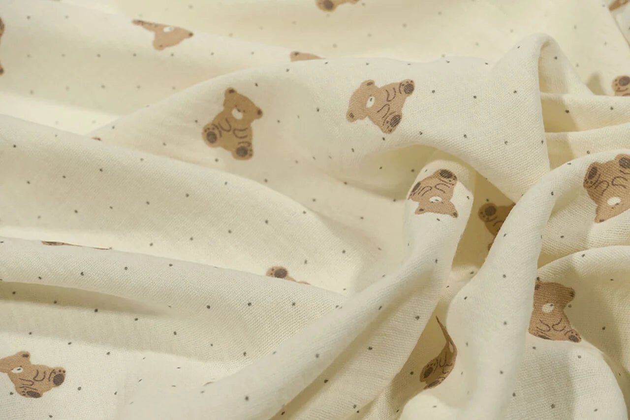 Muslin - bears on a butter-yellow background 125 g/m²