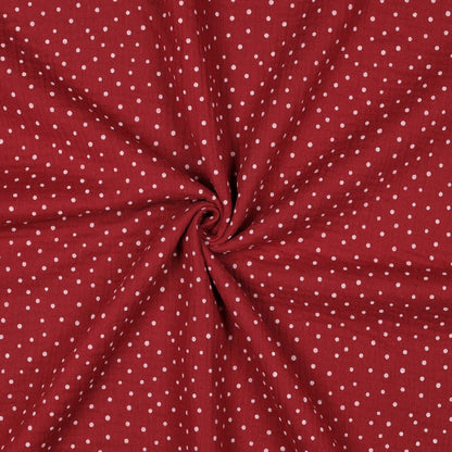Muslin with dots on a dark red background 125 g/m² – available at Šarlotes audumi