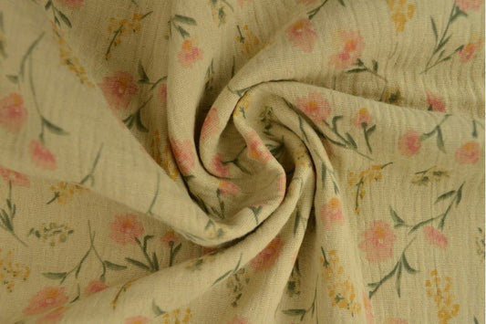 Muslin - delicate flowers on a beige background 140 g/m²