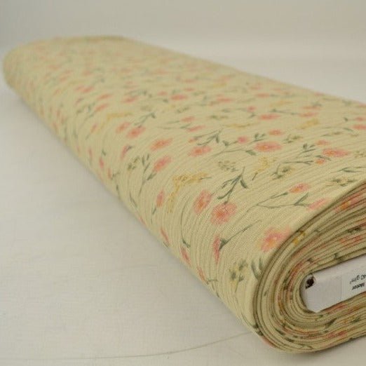 Muślin - drobne kwiaty na beżowym tle 140 g/m²