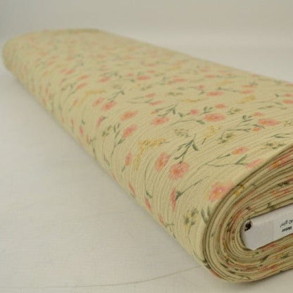Muślin - drobne kwiaty na beżowym tle 140 g/m²