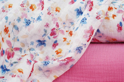 Image of muslin-blue and pink flowers – available online at Charlotte Fabrics