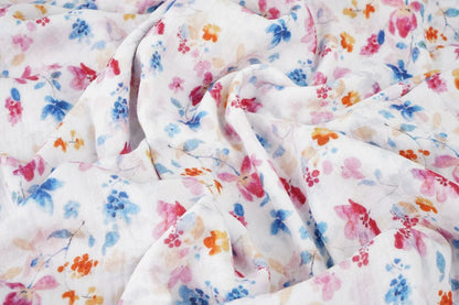 Image of blue and pink floral muslin – available online at Charlotte's Fabrics