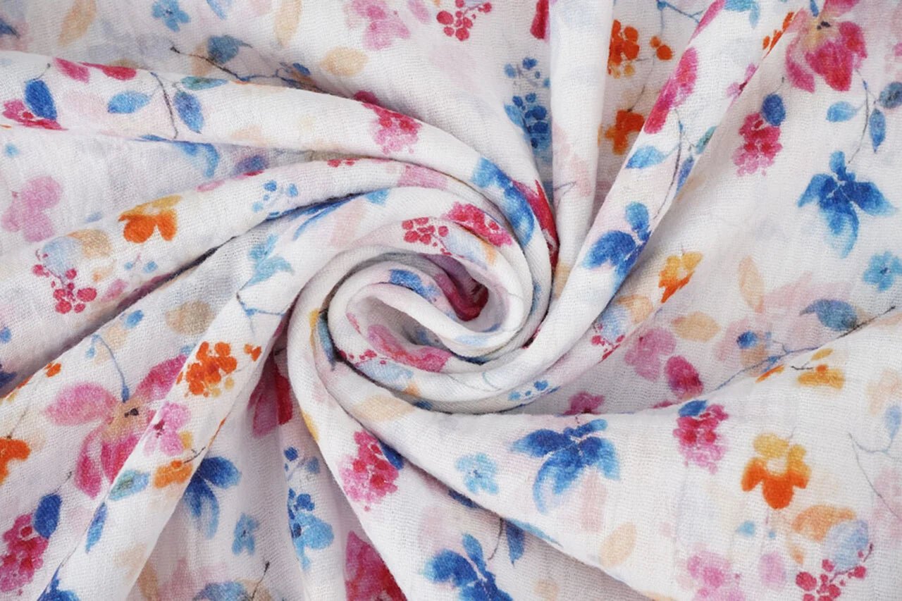 Image with muslin-blue and pink flowers – available online at Charlotte's Fabrics