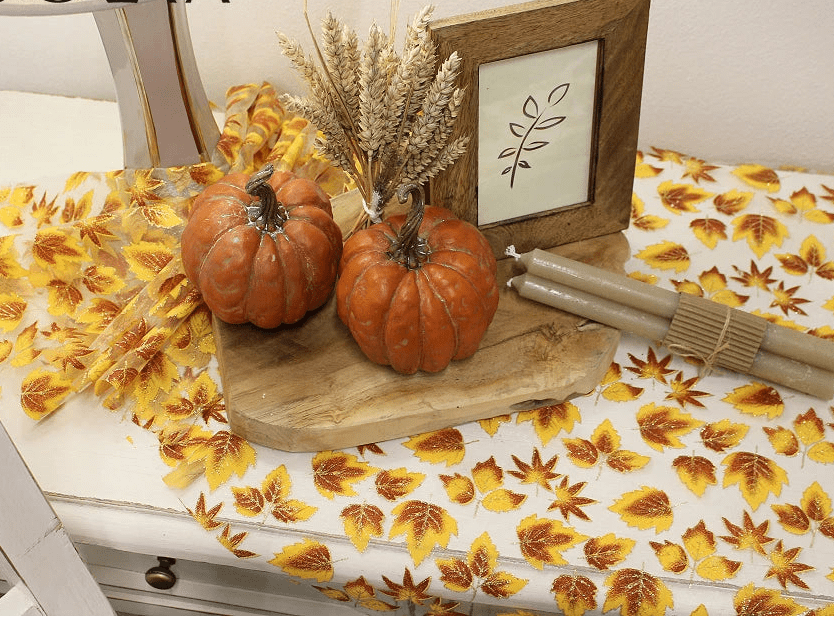 Image of organza fabric with a shimmering autumn leaf pattern – available online at Charlotte's Fabrics
