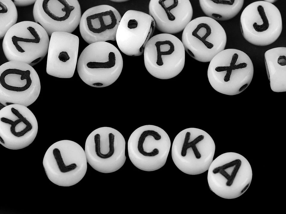 Image of flat glass beads with letters – 6 mm, white with black letters – available online at Šarlotes audumi