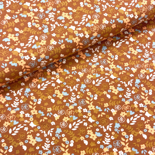 Thin cotton jersey - floral motif on a nut-brown background 220 g/m² (GOTS cert.)
