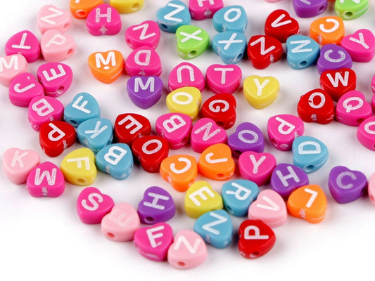 Image of plastic letter beads with hearts | Ø7 mm|10 grams – available at Šarlotes audumi