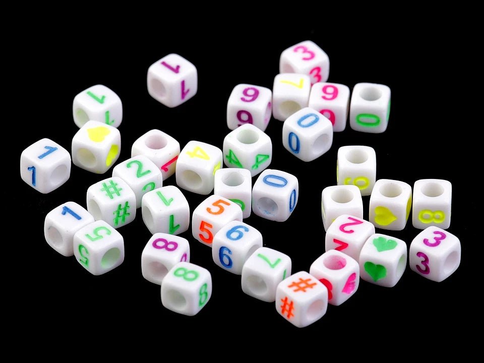 Plastic beads with letters, colorful on a white background 6×6 mm