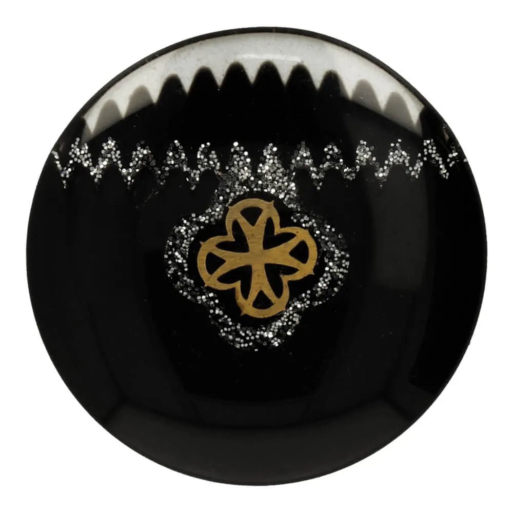 Image of a 19 mm black shank button with ornaments in the center – available at Šarlotes audumi