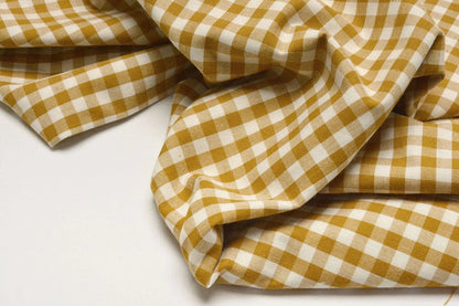 Image of premium cotton fabric in mustard yellow plaid – available online at Charlotte Fabrics