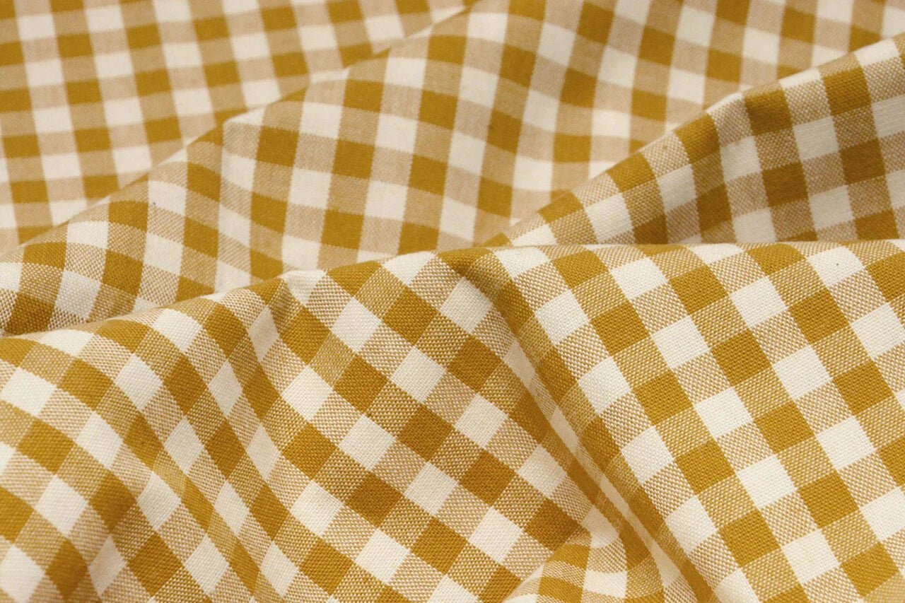Image of premium cotton fabric in mustard yellow plaid – available online at Šarlotes audumi