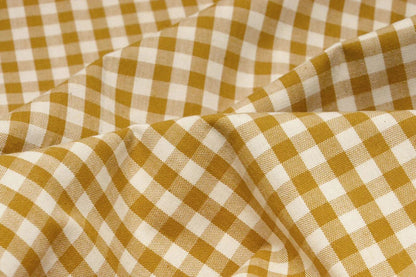 Image of premium cotton fabric in mustard yellow plaid – available online at Šarlotes audumi