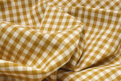 Image of premium cotton fabric in mustard yellow plaid – available online at Charlotte's Fabrics