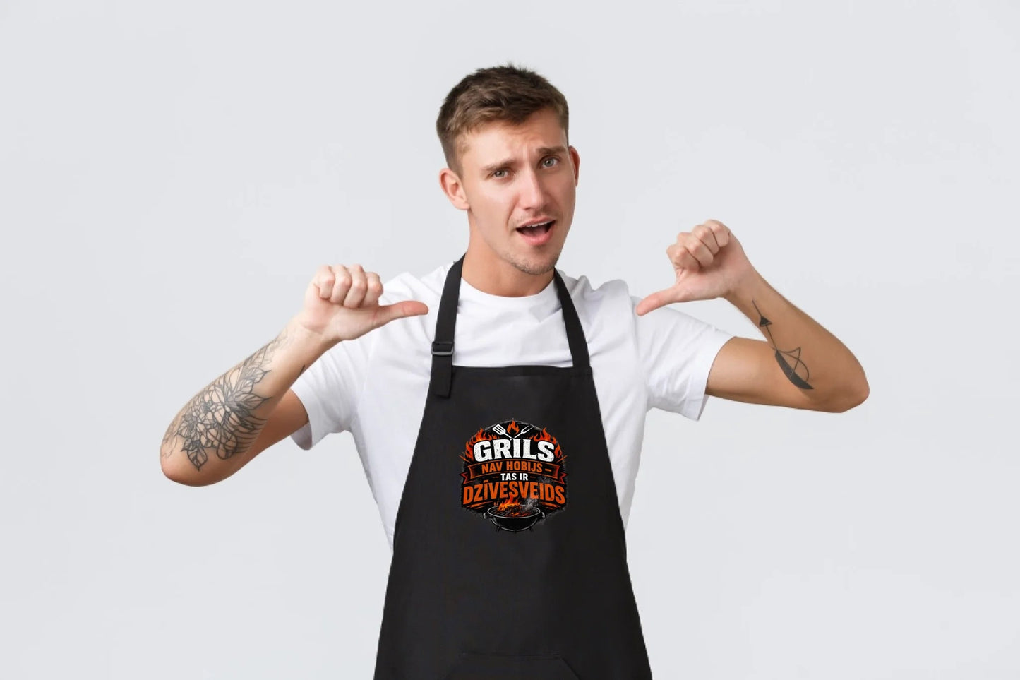 Image of a black apron with "Grilling Is a Lifestyle" – available at Charlotte's Fabrics