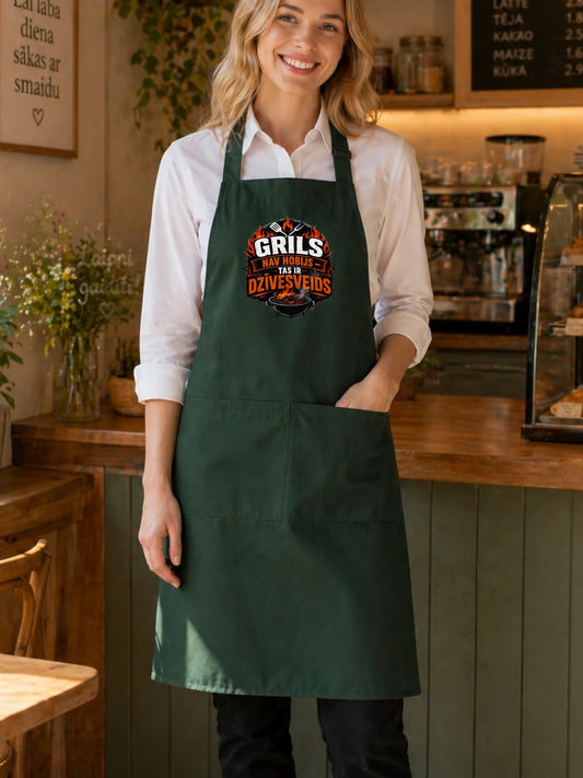 Image of a dark green apron "Grilling is a way of life" – available at Charlotte Fabrics