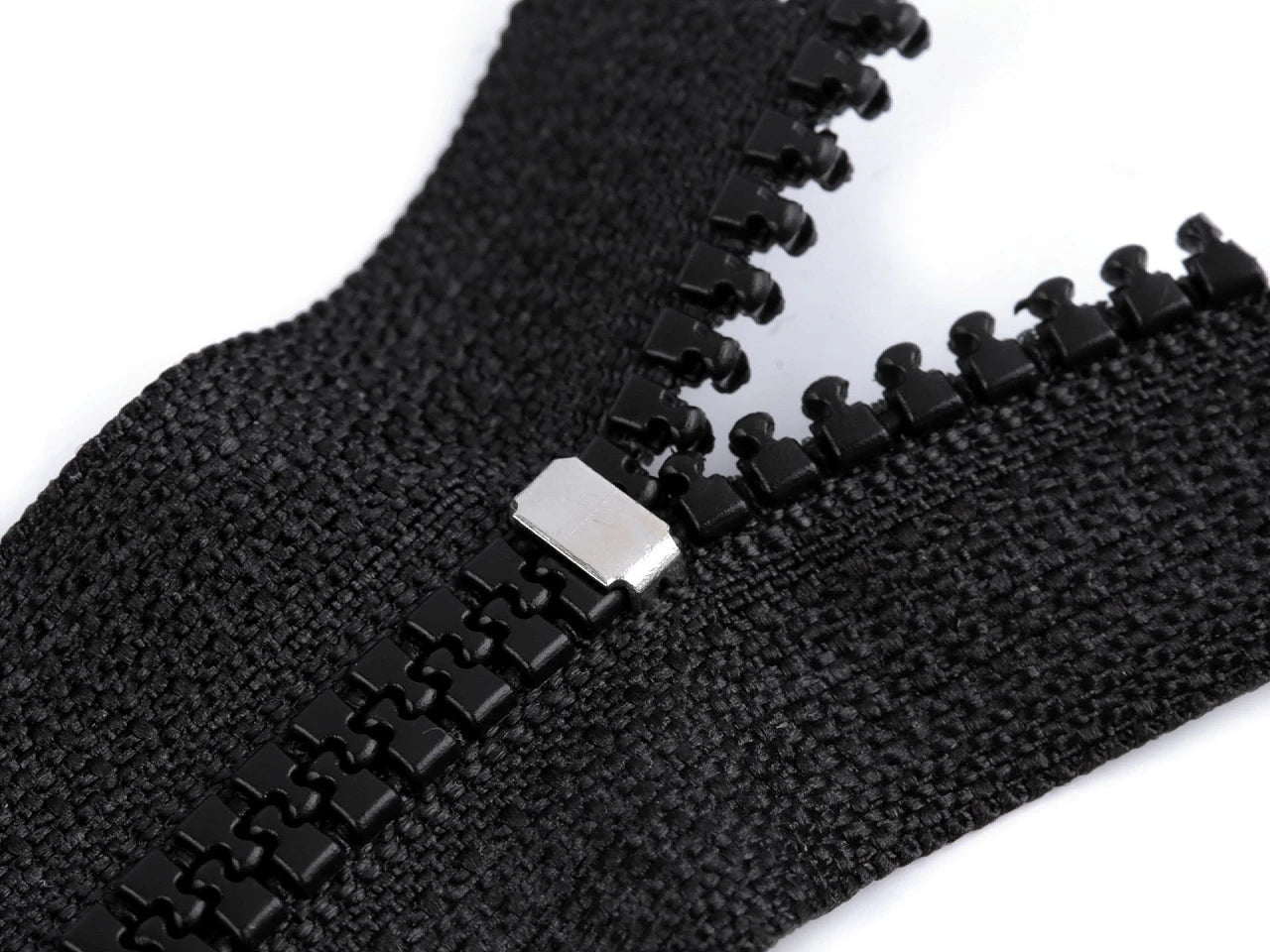 Image with Metal zipper end stopper No. 3 – 3 × 5 mm, antique bronze – available online at Charlotte's Fabrics