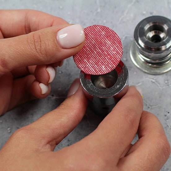 Image of a hand press for button making – available at Charlotte Fabrics
