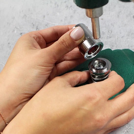 Image of a hand press for making buttons – available at Charlotte Fabrics
