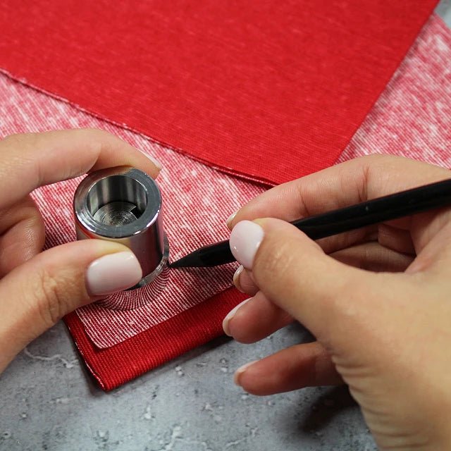 alt
Image with a hand press button-making tool – available at Šarlotes audumi