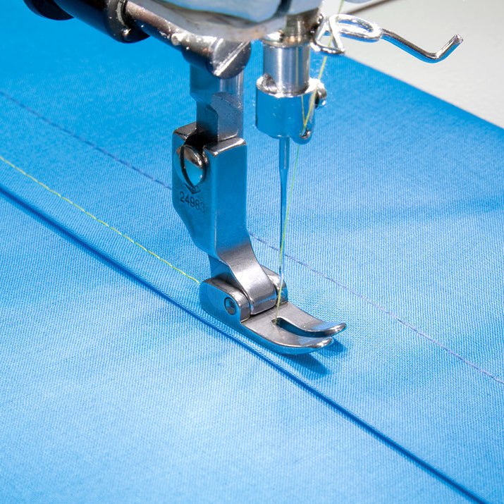 Image of an industrial sewing machine presser foot - for straight stitching – available at Charlotte Fabrics