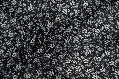 Chiffon - white flowers on a black background | 150 cm | 65 g/m²