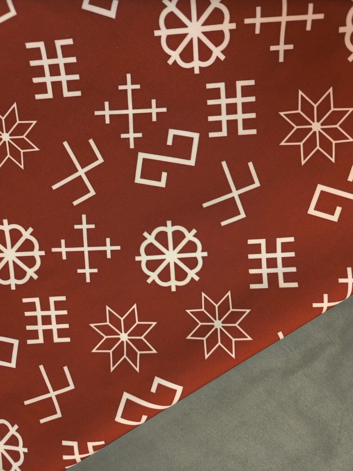 Softshell fabric - with Latvian power symbols on a maroon background 310 g/m²
