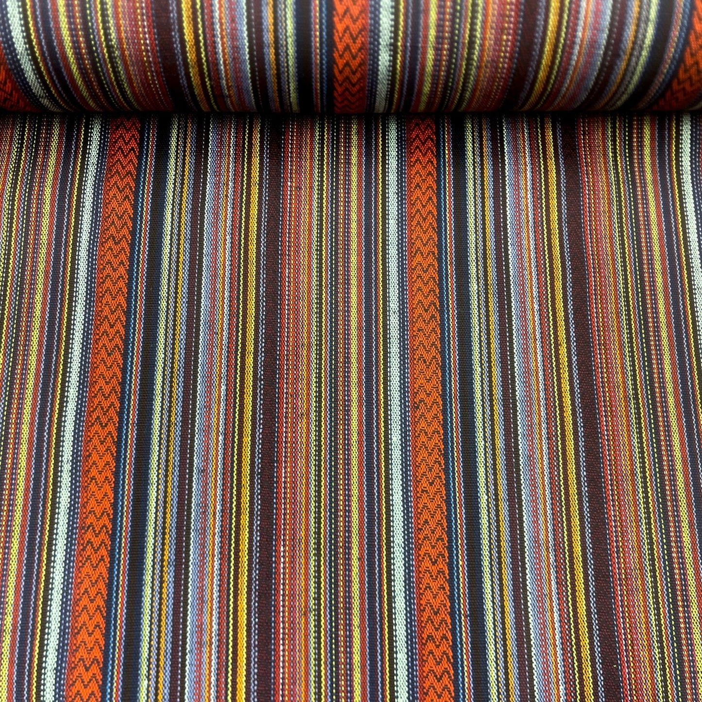 Ethnic pattern fabric in orange and blue tones 200 g/m²