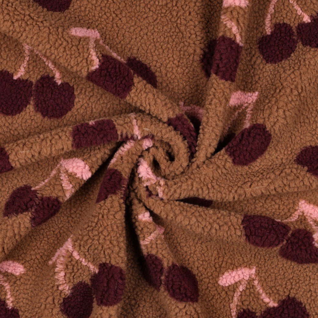 Image of Teddy fleece cherries – available online at Charlotte's Fabrics