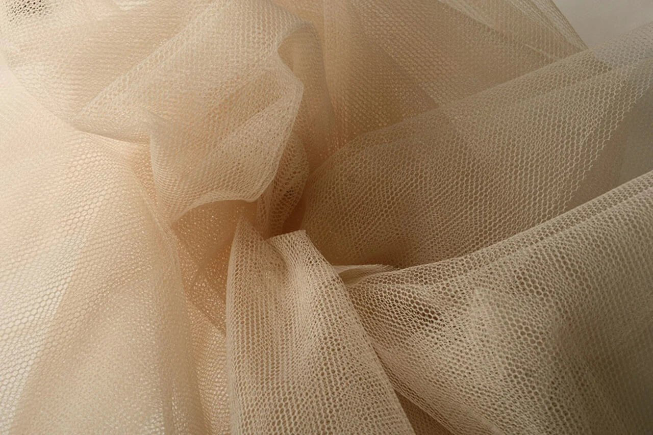 Image of stiff tulle – roasted almond shade | 100% nylon | 20 g/m² 150 cm – available at Charlotte Fabrics