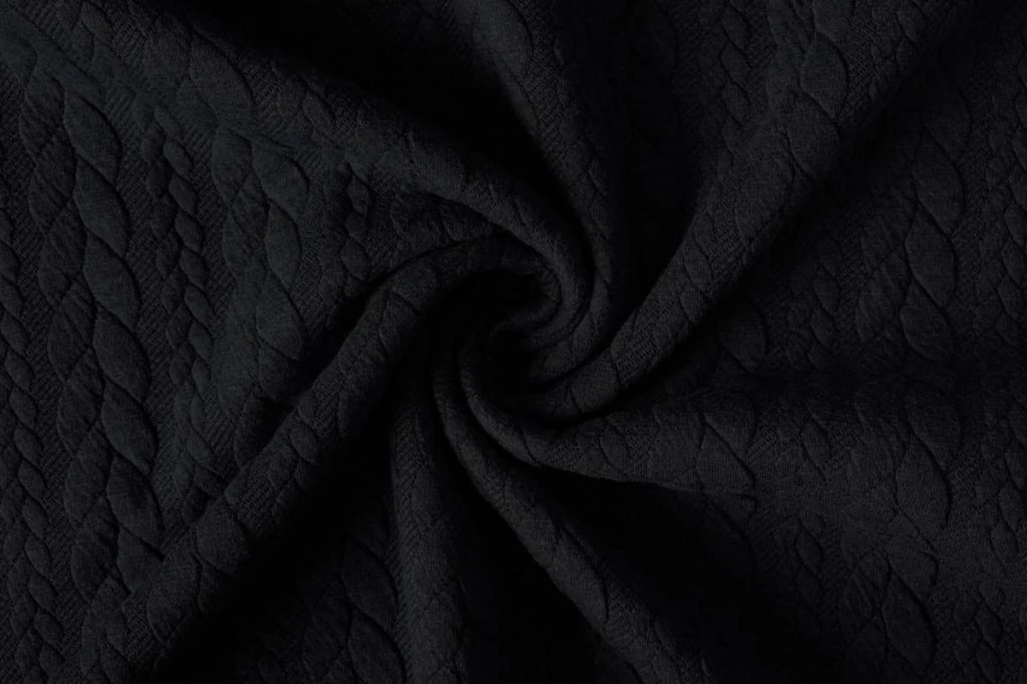 Image of knitted fabric with a knit pattern - black braids 340 g/m² – available at Šarlotes audumi