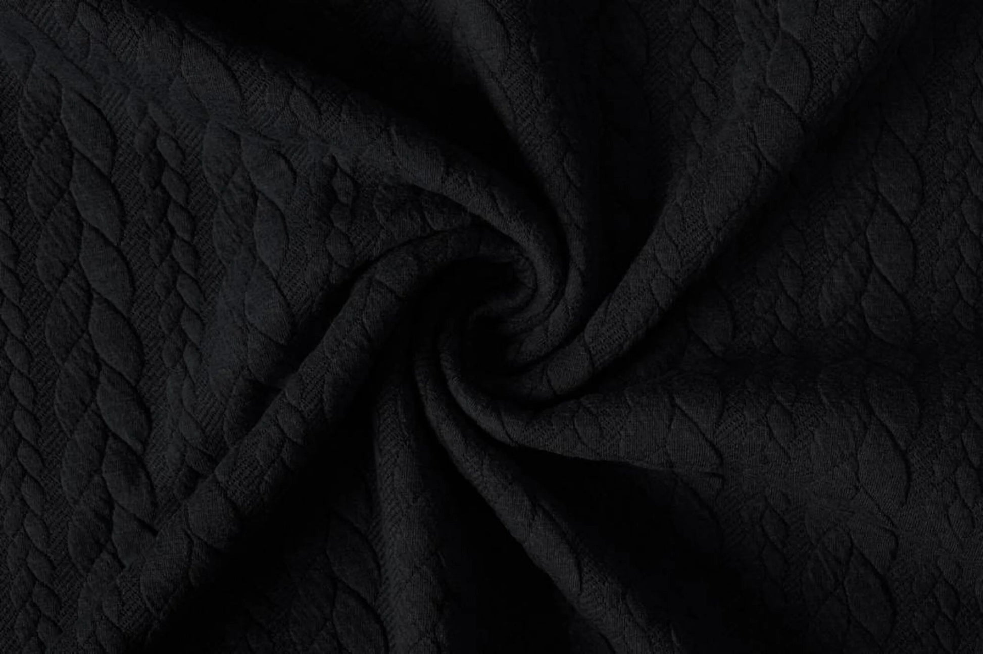 Image of knitted fabric with a knit pattern - black braids 340 g/m² – available at Šarlotes audumi