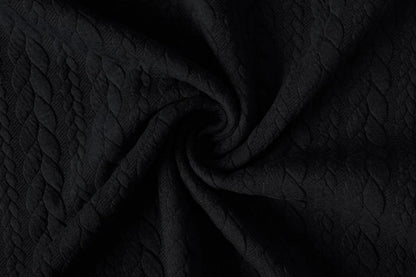 Image of knitted fabric with a knit pattern - black braids 340 g/m² – available at Šarlotes audumi