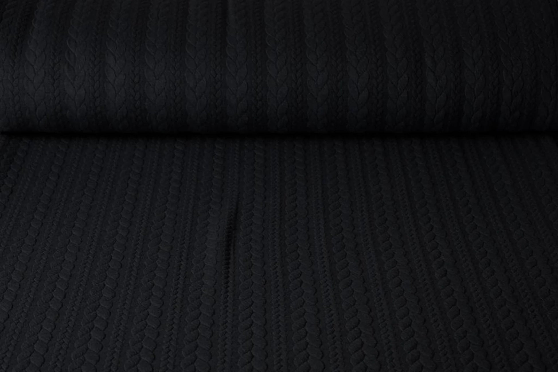 Image of knitted fabric with a knit pattern - black braids 340 g/m² – available at Šarlotes audumi