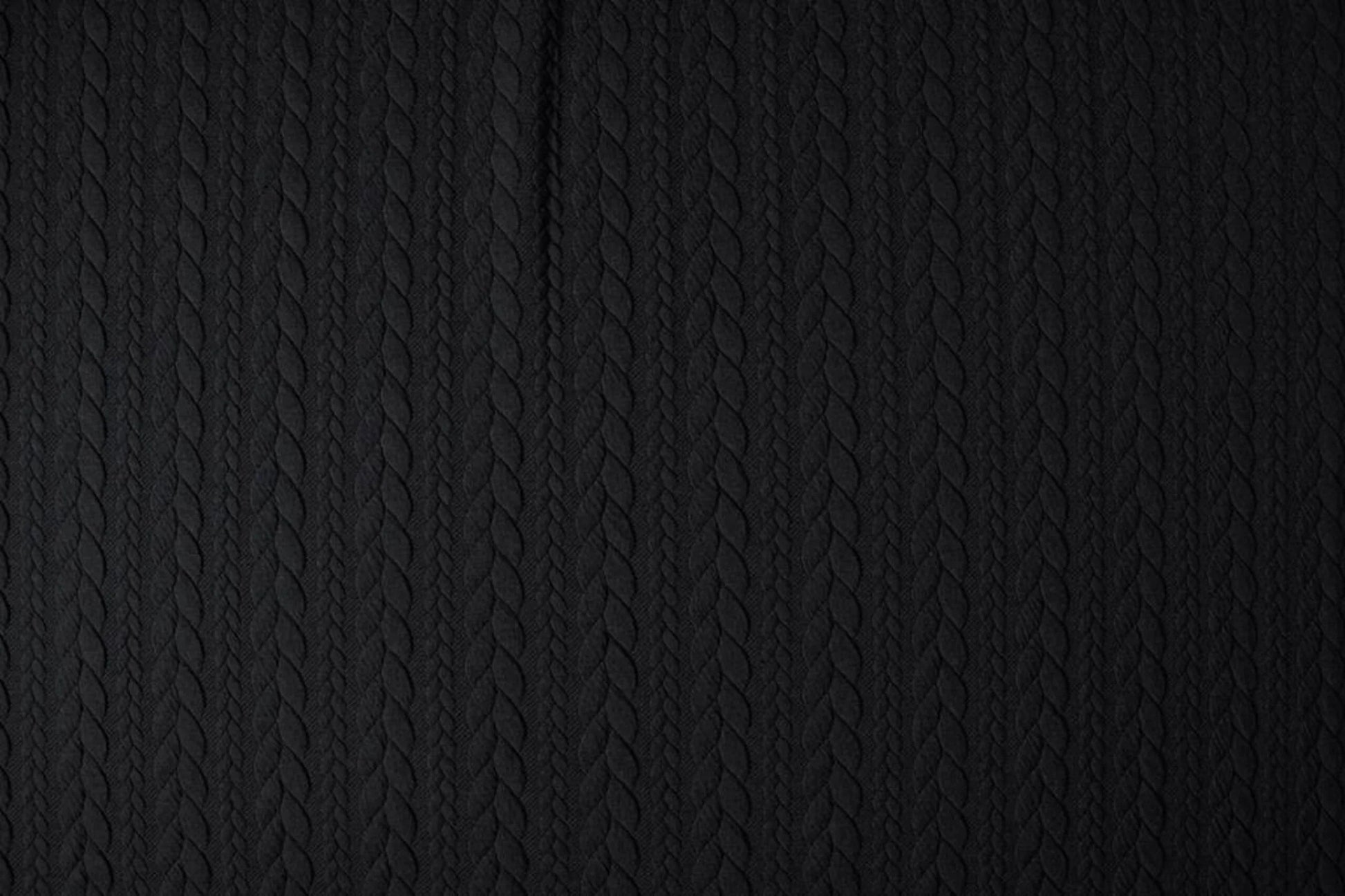 Image of knit fabric with a knitted pattern - black braids 340 g/m² – available at Šarlotes audumi