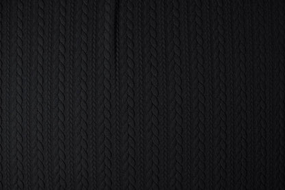 Image of knit fabric with a knitted pattern - black braids 340 g/m² – available at Šarlotes audumi