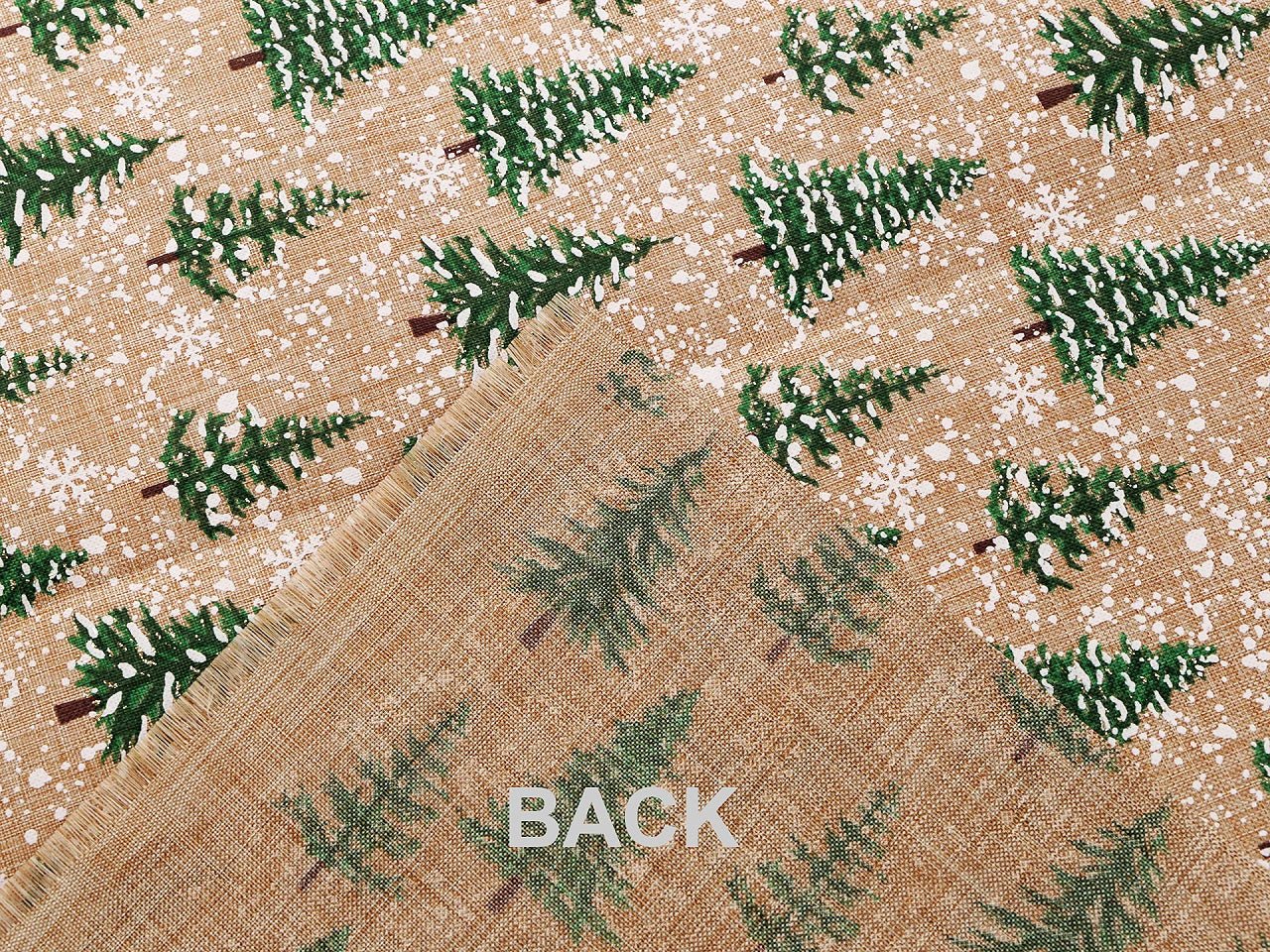 Image of Christmas decorative fabric with fir trees and snow – available online at Charlotte Fabrics