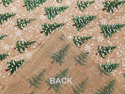Image of Christmas decorative fabric with fir trees and snow – available online at Charlotte Fabrics