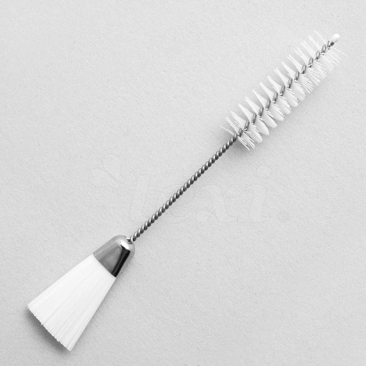 Brush for cleaning sewing machines
