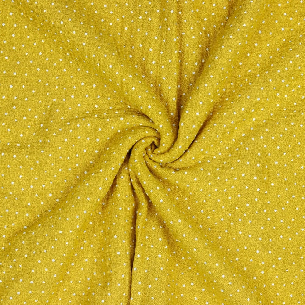 Muslin dots on a honey-yellow background 130 g/m²