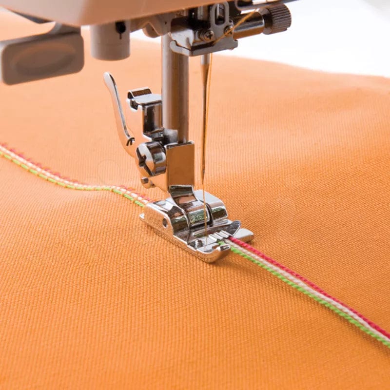 Sewing machine foot for sewing on decorative ribbons and cords